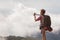 Asian woman traveling backpack her photography morning fog