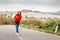 Asian woman travels in Tuscany with Italian flag