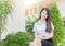 Asian woman in uniform student smile in garden,