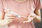 Asian woman using lancet on finger for checking blood sugar level by Glucose meter, Healthcare and Medical, diabetes, glycemia