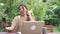 Asian woman using mobile phone selfie post in social media, female relax feeling happy showing shopping bags sitting on table in