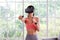 Asian woman virtual reality headset while exercise at home, Healthy asia girl wearing vr glasses for interactive exercise, e sport