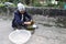 Asian woman wash leaf to packing rice cake