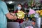 Asian Woman wearing  face mask or protective mask against coronavirus crisis, Florist owner of a small florist business holding