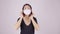 Asian woman is wearing a mask on a white background.