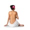 Asian woman wearing towel sitting on the floor