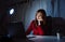 Asian woman working late at night with laptop computer home office looking screen monitor unhappy