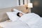 Asian woman are yawning and stretching after waked up  on the bed in morning time