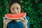 Asian Women biting Slice Of Watermelon