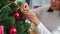 Asian women decorate Christmas tree at Christmas festival. Female teen happy smiling celebrate xmas winter holidays in living room