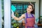 Asian women disinfecting glass door and cleaning the windows at home