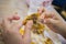 Asian women eating fried chicken, focus woman hand hold fried chicken for eat,girl with fast food concept