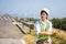 Asian women engineer stands confidently at outdoor on site power plant energy