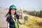 Asian women engineer stands confidently at outdoor on site power plant energy