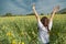 Asian women with slightly curly is raising arms to the sky in y