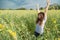 Asian women with slightly curly is raising arms to the sky in y