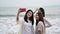 Asian women take photo on the beach. Travel on summer holiday, Thailand. Relax and recreation