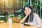 Asian women Thai teen smile with book in coffee shop