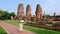 Asian women with tourist map in hand looking at the ruins and Pagodas of Ayutthaya Thailand
