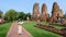 Asian women with tourist map in hand looking at the ruins and Pagodas of Ayutthaya Thailand