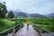 Asian women travel nature. Walking a photo the rice field and stop take a break relax on the bridge at  ban Mae klang luang in