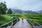 Asian women travel nature. Walking a photo the rice field and stop take a break relax on the bridge at  ban Mae klang luang in