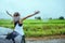 Asian women travel relax in the holiday.Standing in the rain the rainy season.Thailand