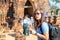 Asian women are traveling in Phra Nakhon Si Ayutthaya. Tourists are shooting portrait. Female photographer photographed in the