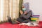 Asian women wearing hijab masks show hand stops and are working from home