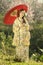 Asian women wearing traditional japanese kimono and red umbrella