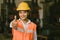 Asian women worker show gesture thumbs up happy smile in factory for good job or done