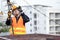 Asian worker repairing an old TV antenna on rooftop