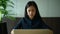 Asian young businesswoman working with computer in office. Stress and disappointment concept