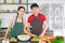 Asian young couple. Are standing smile cooking in the kitchen.