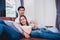 Asian young couples relaxing on sofa. Lovers and Couples concept. Honeymoon and Wedding theme. Interior and Dating theme