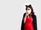 Asian young girl look at you and point out finger while wearing face mask protect covid-19 or coronavirus and red dress, black