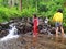 An Asian young girl is playing at waterpark of Cipadayungan forest