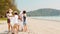 Asian young happy family activists collecting plastic waste on beach. Asia volunteers help to keep nature clean up and pick up