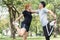 Asian young love couple workout on stretching their bodies together to be prepared for the exercise.