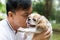 Asian young man with his Shih Tze dog