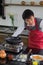 Asian young man is igniting the gas, igniting the stove to prepare food