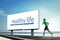 Asian young man running on beach, Sport concept with a big billboard