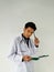 Asian young medical doctor in the critical office in the hospital doing laboratory test