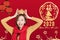 Asian young woman celebrating for chinese new year. chinese text happy new year 2020