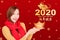 Asian young woman celebrating for chinese new year. chinese text happy new year 2020