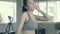 Asian young woman exercise with running on treadmill in the gym, asia girl workout doing cardio with tired and wiping sweat