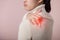 Asian young woman hold her hand on pain neck and injury ache shoulder stress problem muscle. Office syndrome disease, healthcare