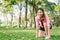 Asian young woman on mark to set ready for jogging exercise to build up her body on glass in warm light morning.