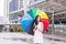 Asian young woman smling and holding umbrella in city,Lifestyle concept,Happy and smiling