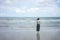 Asian young woman standing facing the sea. Feeling really lonely, heartbroken sea like a nursery of clearing the mind. The concept